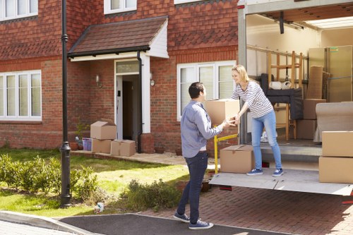Removal van and moving team helping with a home move in Becontree