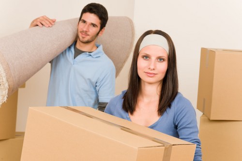 Movers handling furniture and fragile items during a home move